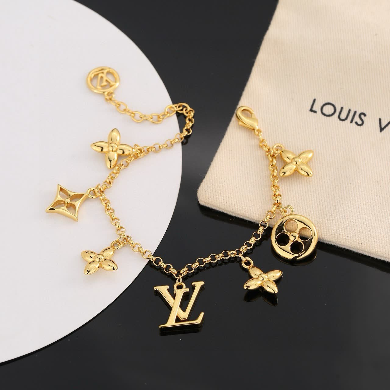 Louis Vuitton Gold Tone Bracelet with Charms